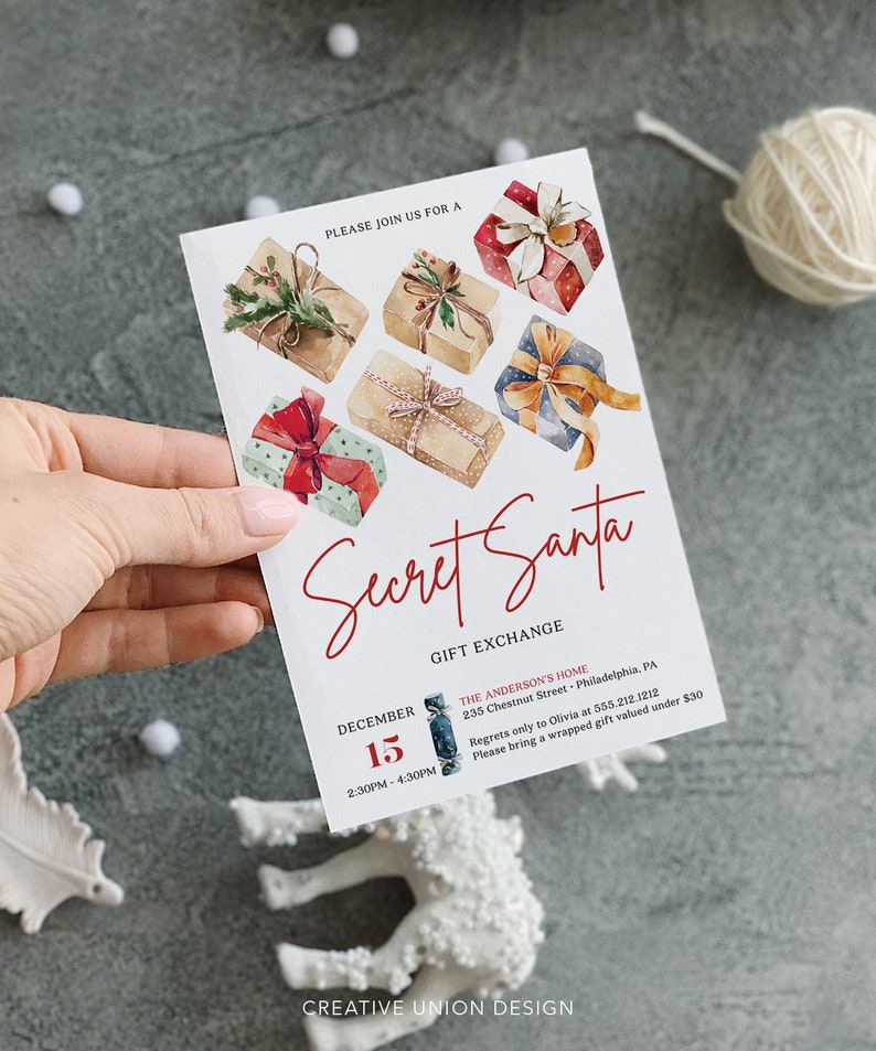 May include: A white rectangular Secret Santa gift exchange invitation card featuring watercolor illustrations of six wrapped presents with ribbons. The text reads: Secret Santa, Gift Exchange, December 15, 2:30PM - 4:30PM, The Anderson's Home, 235 Chestnut Street, Philadelphia, PA, and details regarding a gift valued under $30.