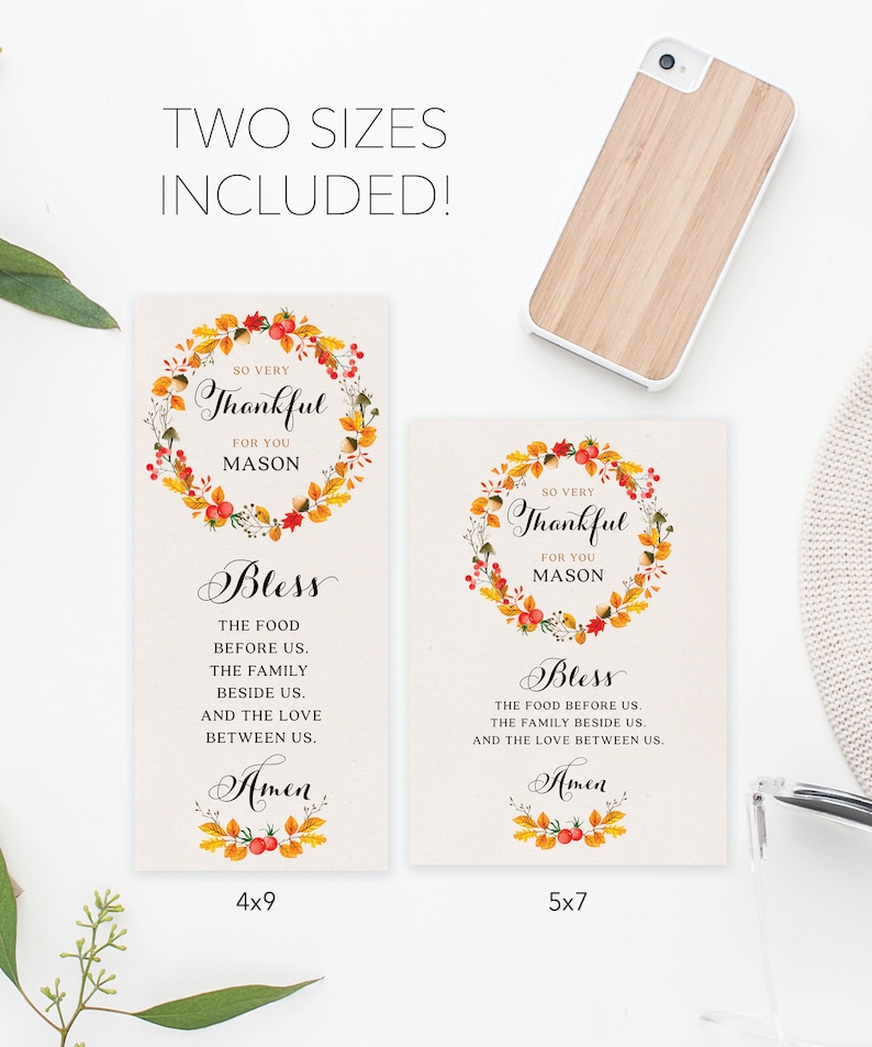 May include: Two printable Thanksgiving place cards with a fall-themed wreath design. The text reads "So very thankful for you Mason" and "Bless the food before us, the family beside us, and the love between us. Amen". The cards are available in two sizes: 4x9 inches and 5x7 inches.