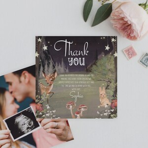 May include: A thank you card with a woodland theme. The card features a deer and a rabbit in a forest setting with stars and mushrooms. The text on the card reads "Thank You" and "With Love, Sophia".