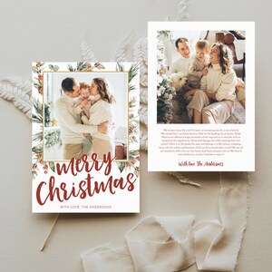 May include: A Christmas card with a family photo inside a gold frame, surrounded by greenery and red berries. The words "Merry Christmas" are in red script, with "With Love, The Andersons" below.
