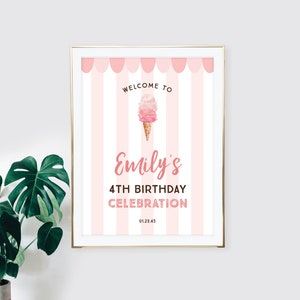 May include: A framed pink and white striped sign with the text "Welcome to Emily's 4th Birthday Celebration." The sign features a watercolor ice cream cone illustration and a pink scalloped border.