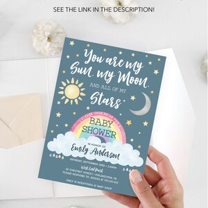 May include: A blue baby shower invitation with a rainbow, stars, a sun, and a moon. The text reads "You are my Sun. my Moon. And all of my Stars."  "Please join us as for a Baby Shower in honor of Emily Anderson. Saturday, September 23rd, 2:00pm. West End Park, 23 Chestnut Street, Philadelphia, PA. Please respond to Jessica at 555.212.1212. Emily is registered at Baby Shop."