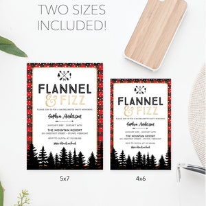 K&ouml;nnte beinhalten: Zwei Einladungskarten mit dem Text "FLANNEL & FIZZ" in Gold und Schwarz, f&uuml;r einen Junggesellinnenabschied. Die Karten sind in den Gr&ouml;&szlig;en 5x7 und 4x6, mit einem rot-schwarzen Karomuster und einer Waldsilhouette. Eine Handyh&uuml;lle aus Holz ist ebenfalls vorhanden.