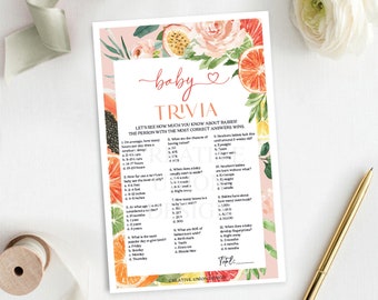 May include: A pink and white baby shower trivia game with floral illustrations and citrus fruit accents. The game includes questions about babies, such as how many hours a baby sleeps per day, how many bones a baby has, and when a baby develops fingerprints. The game also includes a space for the player to write their total score.