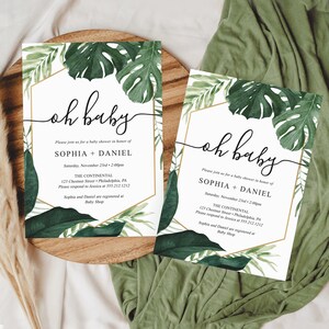 May include: Two tropical-themed baby shower invitations with a gold hexagon frame and green monstera leaves. The text on the invitations reads "oh baby" and includes the names Sophia and Daniel, the date and time of the shower, and the location.
