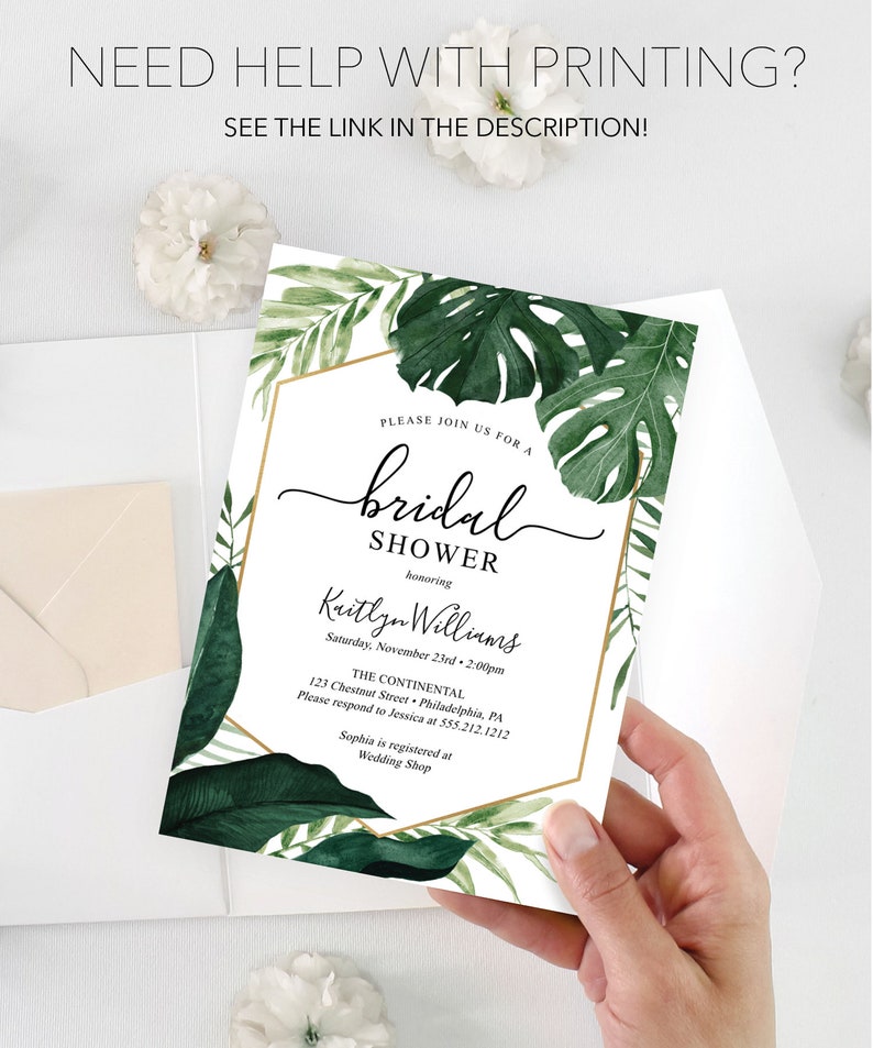 May include: A white bridal shower invitation with green tropical leaves and gold accents. The invitation reads "Please join us for a bridal shower honoring Kaitlyn Williams, Saturday, November 23rd, 2:00pm, The Continental, 123 Chestnut Street, Philadelphia, PA. Please respond to Jessica at 555.212.1212. Sophia is registered at Wedding Shop."