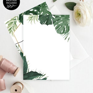 May include: A white card with a gold frame and green tropical leaves around the border. The text "CREATIVE UNION DESIGN" is at the bottom of the card.