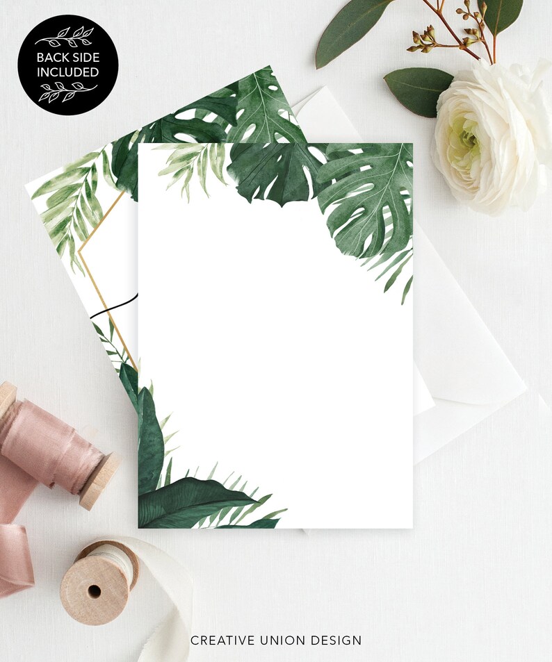 May include: A white card with a gold frame and green tropical leaves around the border. The text "CREATIVE UNION DESIGN" is at the bottom of the card.