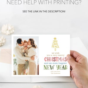 May include: A rectangular holiday greeting card featuring a photograph of a family on the left and text on the right. The text reads: JOY LOVE PEACE, we wish you a very merry CHRISTMAS and an even happier NEW YEAR with love from, The Andersons.