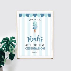 May include: A blue and white striped welcome sign with a blue ice cream cone graphic and the text "Welcome to Noah's 4th Birthday Celebration 01.23.45"