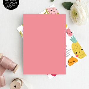 May include: A pink card with a white background featuring a pattern of cartoon fruits with smiling faces. The fruits include a watermelon, a pineapple, a strawberry, and an orange. The text on the card reads "PM, PHILADELPHIA, PA, AND FUN! 5-312-1212."