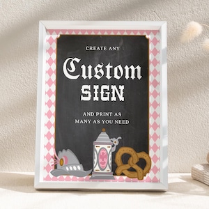 May include: Framed sign with the words "Custom Sign" in white, on a black background. The sign has a pink and white diamond pattern border. Decorative elements include a beer stein, pretzel, and hat.