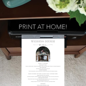 May include: A printable wedding dinner menu with a black and white design. The menu features a photo of a couple under an archway, and lists hors d'oeuvres, main course options, and dessert. The text "Wedding Dinner" is written in cursive.