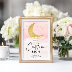 Puede incluir: Un cartel imprimible con una luna creciente dorada y estrellas sobre un fondo rosa. El texto dice "Crea cualquier cartel personalizado e imprime tantos como necesites!"