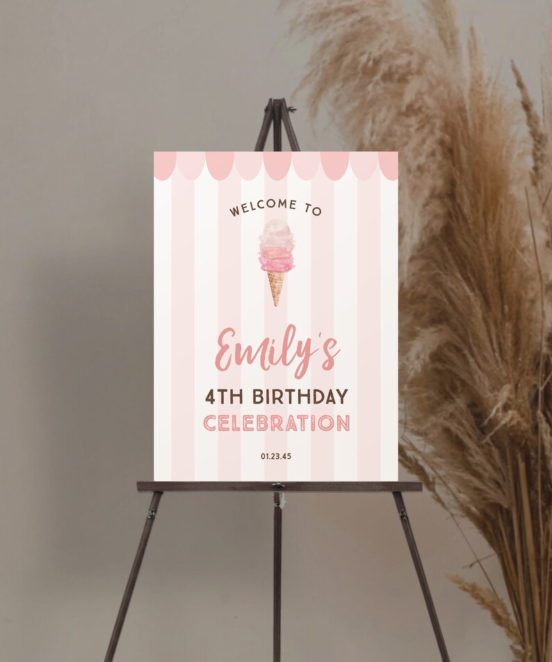 May include: A pink and white striped welcome sign for a birthday celebration. The sign reads "Welcome to Emily's 4th Birthday Celebration" with an ice cream cone graphic. The sign is displayed on a wooden easel.