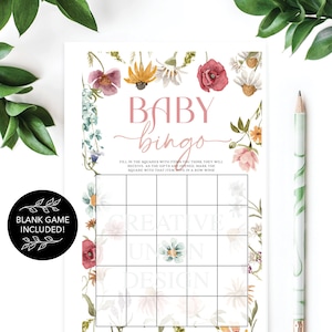 May include: A floral themed baby bingo card with a pink and white color scheme. The card has a grid with squares to fill in with items you think the baby will receive. The text "BABY bingo" is at the top of the card. The text "FILL IN THE SQUARES WITH ITEMS YOU THINK THEY WILL RECEIVE. AS THE GIFTS ARE OPENED, MARK THE SQUARE WITH THAT ITEM. FIVE IN A ROW WINS!" is below the title. The text "BLANK GAME INCLUDED!" is in a circle at the bottom left of the card.