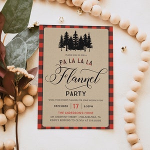 May include: A rectangular invitation with a red and black plaid border. The invitation features the text "FA LA LA LA Flannel PARTY" with a silhouette of pine trees. The date is December 17th at 6:30 PM.