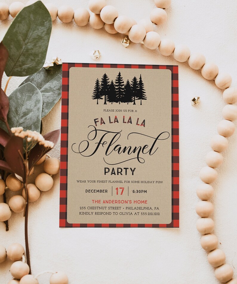 May include: A rectangular invitation with a red and black plaid border. The invitation features the text "FA LA LA LA Flannel PARTY" with a silhouette of pine trees. The date is December 17th at 6:30 PM.