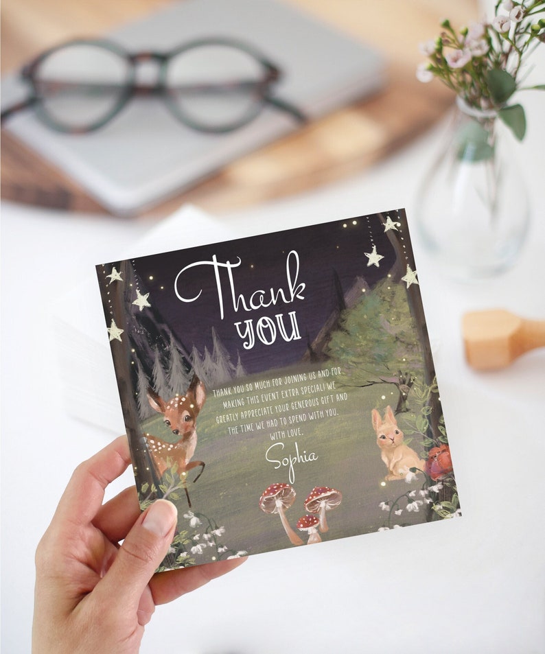 May include: A thank you card with a woodland theme. The card features a deer, a rabbit, mushrooms, and stars. The text on the card reads "Thank You" and "Thank you so much for joining us and for making this event extra special. We greatly appreciate your generous gift and the time we had to spend with you. With love, Sophia."