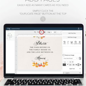 May include: A laptop screen displaying a design program with a page showing a Thanksgiving themed card with the text "Bless the food before us. The family beside us. And the love between us. Amen." The card features a wreath of fall leaves and berries.