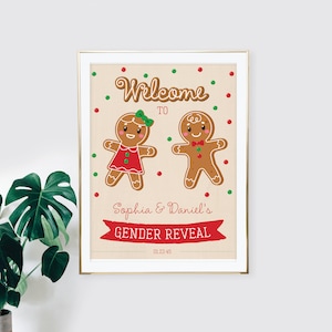 May include: A framed gender reveal print featuring gingerbread people. The print reads "Welcome to Sophia & Daniel's Gender Reveal" with a date below. The gingerbread figures are decorated with red, green, and brown accents.