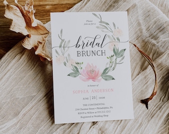 May include: A rectangular bridal brunch invitation card featuring a watercolor floral wreath in shades of pink and green. The text reads: Please join us for a bridal BRUNCH in honor of SOPHIA ANDERSON JUNE 23 10AM THE CONTINENTAL 234 Chestnut Street Philadelphia PA RSVP to Willow at 555.212.1212 Registered at Wedding Shop.