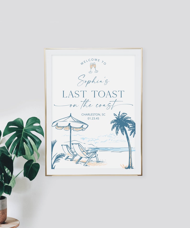 May include: A white sign with blue text and illustrations announcing "Welcome to Sophia's Last Toast on the Coast" with the location Charleston, SC and a date. The sign features a beach scene with palm trees, beach chairs, and an umbrella.