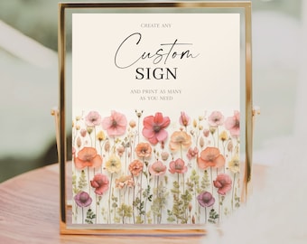 May include: A gold-framed sign with the text "Create any Custom Sign and print as many as you need." The sign is decorated with a floral design of pressed flowers in shades of pink, orange, and yellow.