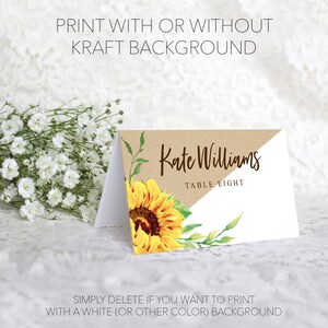 May include: A folded place card with a sunflower design. The card features the name "Kate Williams" and "Table Eight" in elegant script. Text on the card reads "Print with or without kraft background" and "Simply delete if you want to print with a white (or other colour) background."
