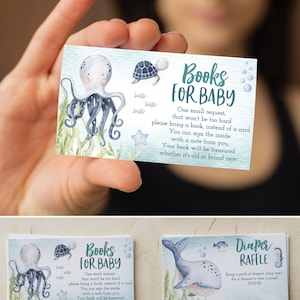 May include: Two blue and white cards featuring an octopus and a whale. The cards read "Books for Baby" and "Diaper Raffle".