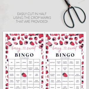 May include: A printable baby shower bingo card with a strawberry pattern. The card has a pink and black color scheme and says "berry sweet" at the top. The bingo card has squares with baby shower related items like "onesie", "night light", "baby monitor", "crib sheet", "stuffed animal", "diaper bag", "gift card", "high chair", "baby lotion", "pacifier", "baby bathtub", "socks", "blanket", "bath towel", "diapper pail", "book", "swing", "baby shampoo", "hat", "bib", "wipes", "stroller", and "diaper cream".