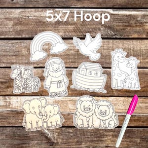 May include: A set of eight white die-cut shapes featuring black line art illustrations of a rainbow, a dove, two zebras, a bearded figure, an ark, two giraffes, two elephants, and two lions, accompanied by a pink chisel tip dry erase marker.