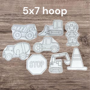 May include: A collection of white felt construction-themed cutouts, including a dump truck, bulldozer, cement mixer, steamroller, stop sign, excavator, traffic cone, and a construction worker. The text "5x7 hoop" is at the top.
