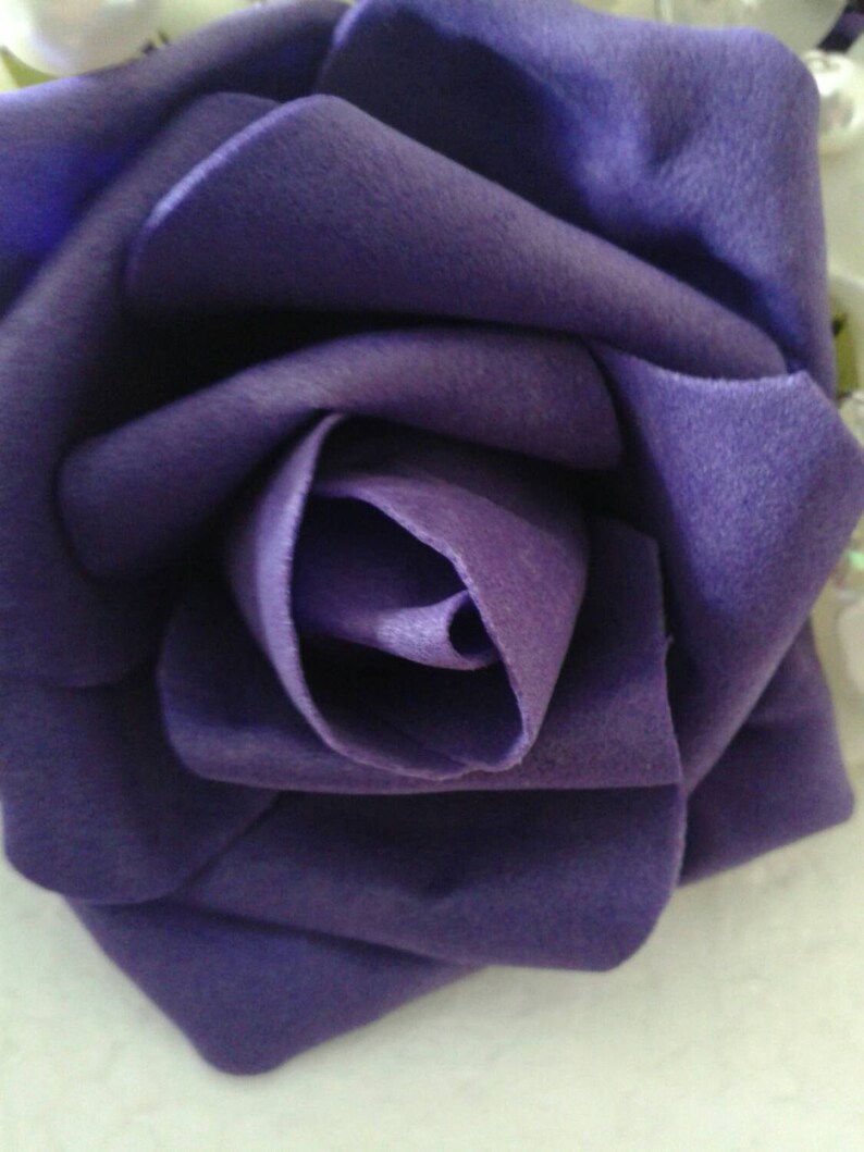 Cadbury Purple and ivory foam rose cake topper adorned Cadbury Purple and ivory foam rose cake topper adorned
