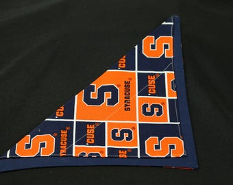 May include: A blue and orange triangular bandana with the repeated pattern of the letter "S" and the words "Syracuse" and "'Cuse".