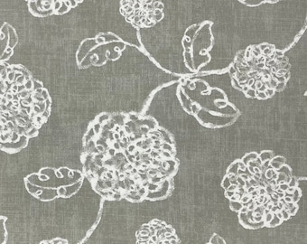 May include: A gray fabric with a white floral pattern. The flowers are stylized and have a slightly distressed look. The fabric has a subtle texture.