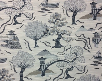 May include: A white fabric with a repeating pattern of black and gray Japanese-inspired imagery. The pattern includes trees, bridges, mountains, and boats.