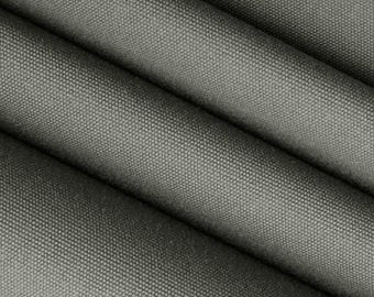 May include: Close-up of a dark gray canvas fabric with a textured weave. The fabric is folded in half, showing the inside and outside of the material.