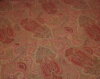 May include: Red and gold paisley patterned fabric with a repeating design.