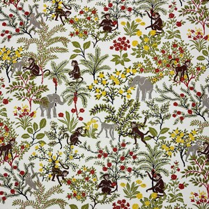 May include: A white fabric with a repeating pattern of monkeys, elephants, and flowers. The monkeys are brown and the elephants are gray. The flowers are red, yellow, and green.