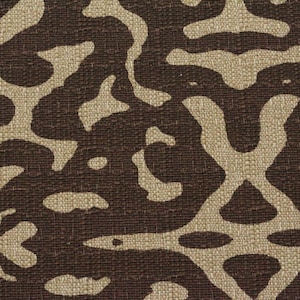 May include: A brown fabric with a tan abstract pattern. The fabric has a woven texture.