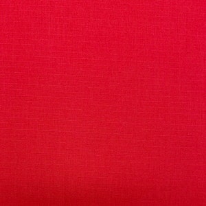 May include: A solid red fabric with a subtle textured pattern.