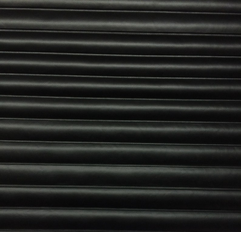 May include: Black corrugated metal surface with horizontal lines.