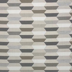 May include: A geometric pattern fabric with a repeating design of stacked, overlapping rectangles in shades of gray, brown, and white.