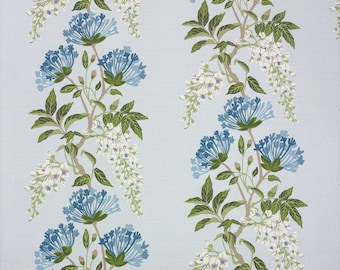 May include: A light blue fabric featuring a repeating vertical pattern of climbing vines with green leaves, white wisteria-like flower clusters, and rounded blue floral blooms arranged in a structured, symmetrical botanical design.