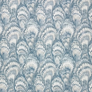 May include: A blue and white marbled fabric with a swirling pattern of overlapping fan shapes.