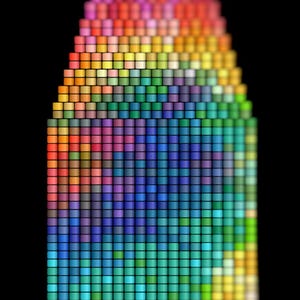 May include: An abstract digital artwork showing a pyramid shape constructed from small, colourful squares. The colour palette ranges from reds and oranges at the base, transitioning through greens and blues, to purples at the apex, all set against a black backdrop.