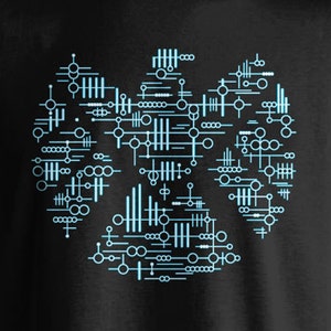 May include: Black t-shirt featuring a blue and white geometric design in the shape of a heart.
