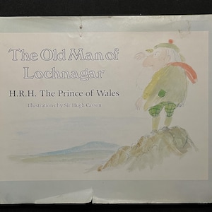 May include: A book cover featuring the title "The Old Man of Lochnagar" with text by H.R.H. The Prince of Wales and illustrations by Sir Hugh Casson. The cover art depicts an elderly man in traditional Scottish attire standing on a rock.