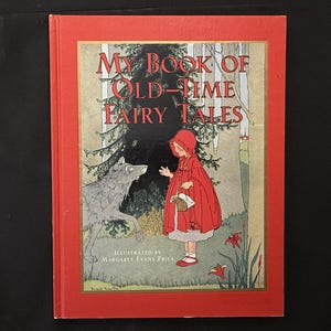Puede incluir: Un libro antiguo titulado "My Book of Old-Time Fairy Tales" con una cubierta roja. La ilustración de la portada representa a una niña con capa y capucha rojas, frente a un lobo en un entorno forestal. El libro está ilustrado por Margaret Evans Price.